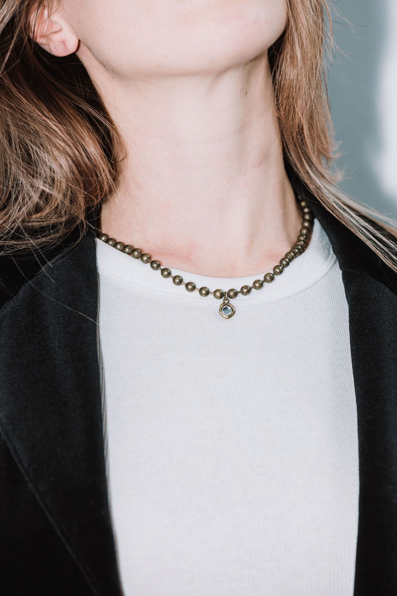 Woman wearing oxidized silver statement necklace