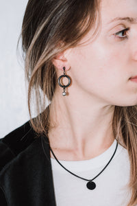 Gunmetal earrings with crystal charm.